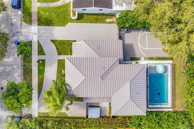 a aerial view of a house with a garden and plants