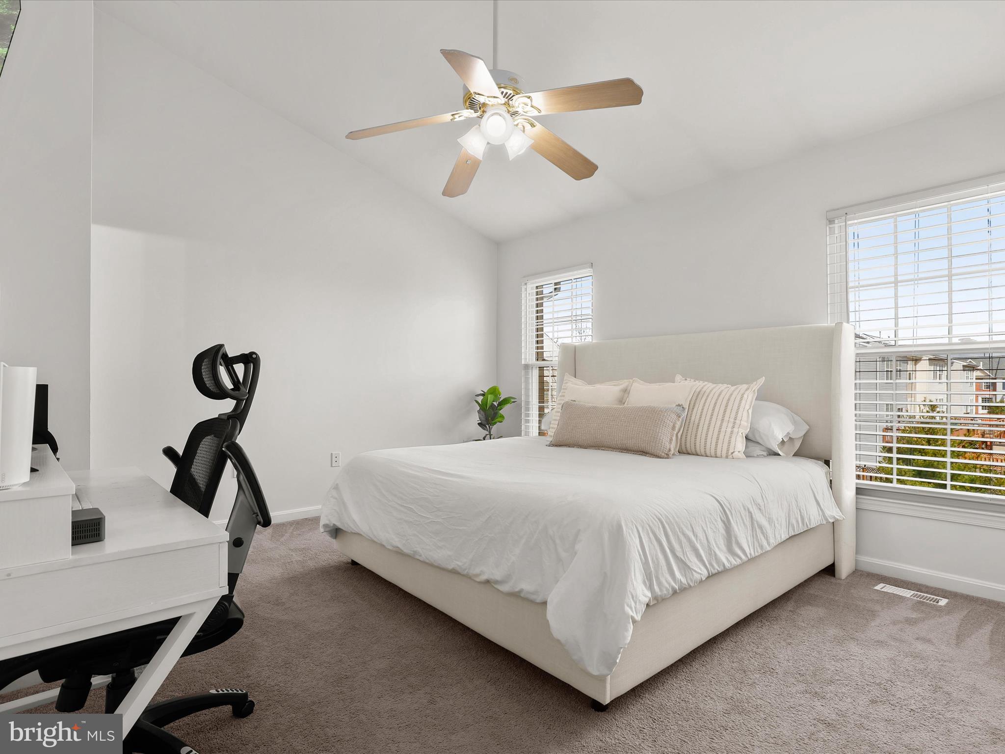 174 Harpers Way Frederick, MD 21702 - Photo 16 of 56 a bedroom with a bed and a chandelier
