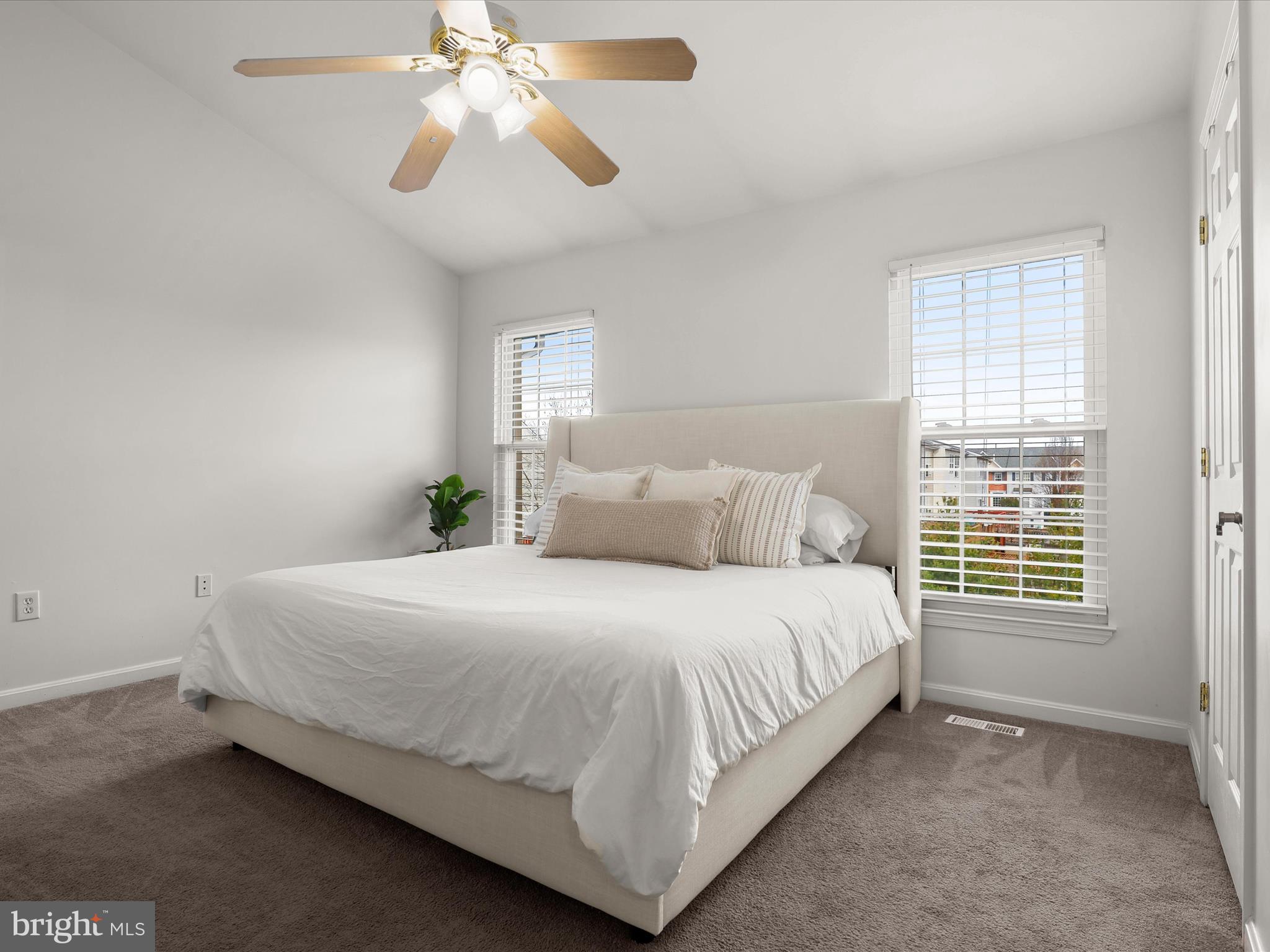 174 Harpers Way Frederick, MD 21702 - Photo 17 of 56 a bedroom with a bed and a chandelier