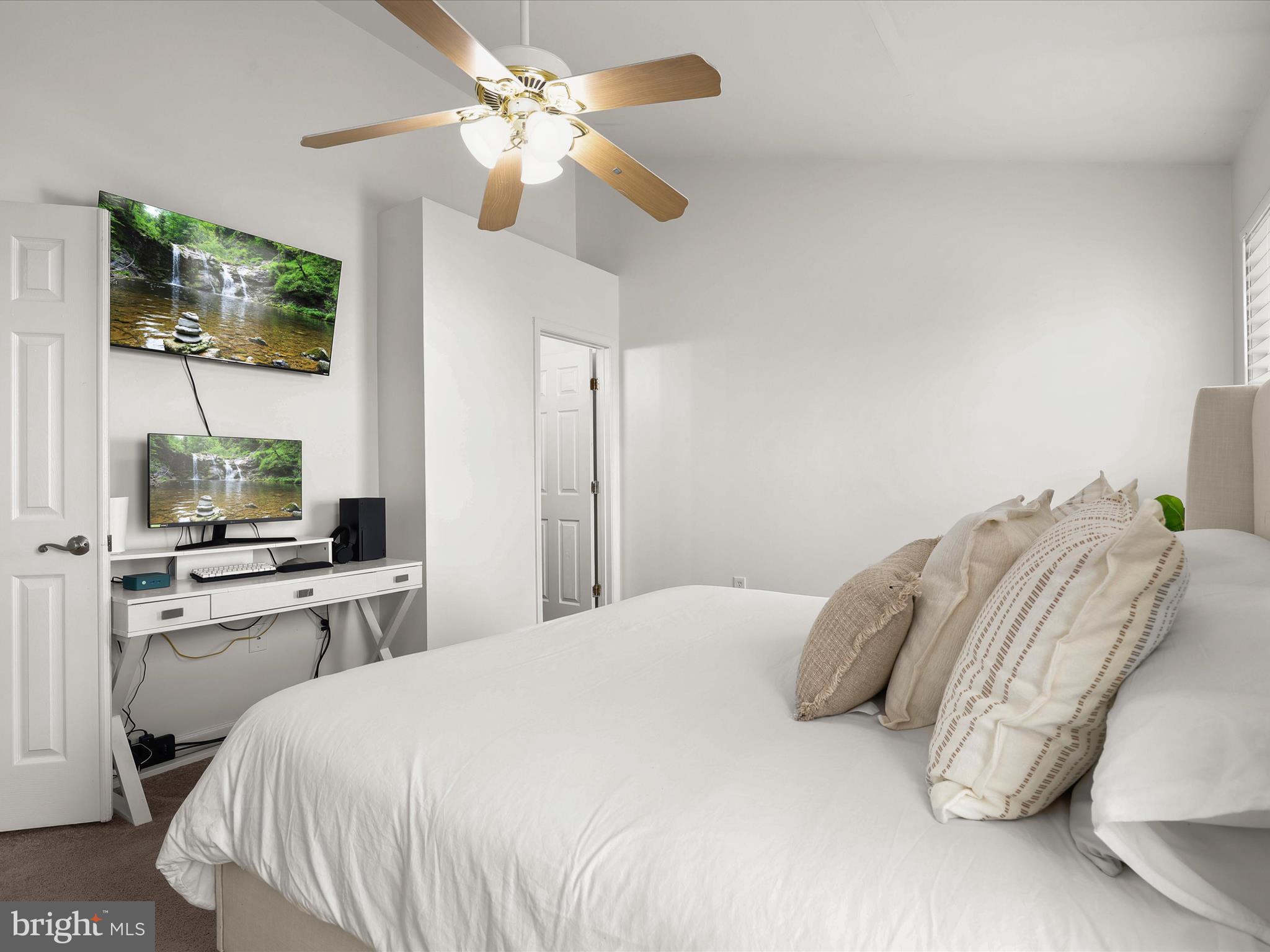 174 Harpers Way Frederick, MD 21702 - Photo 19 of 56 a bedroom with a bed and a flat screen tv