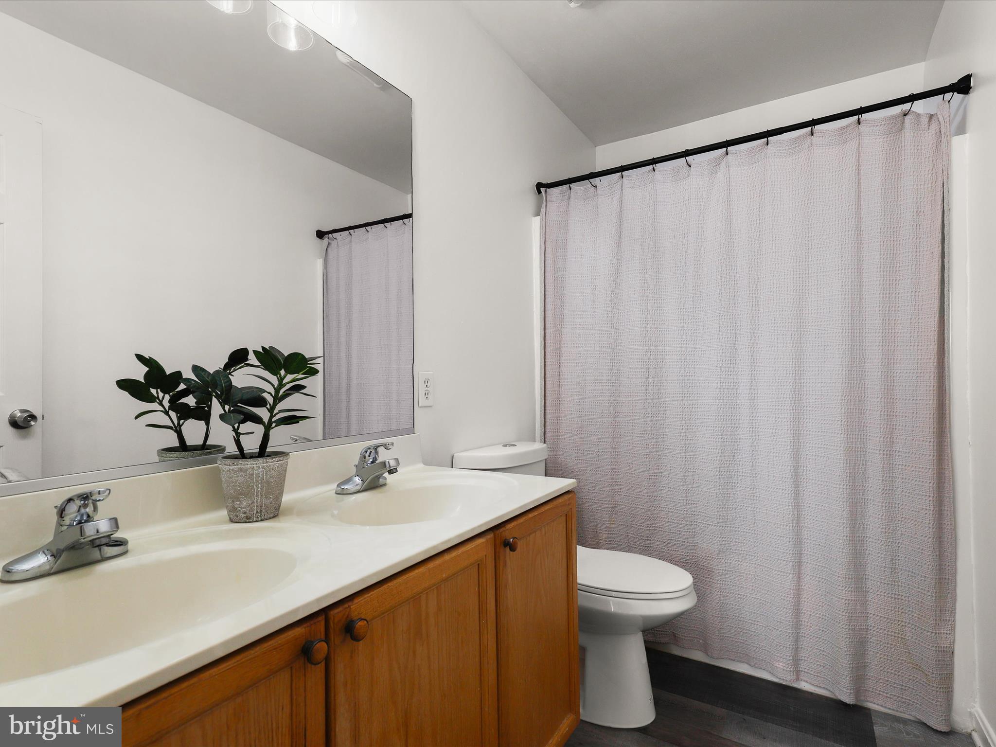 174 Harpers Way Frederick, MD 21702 - Photo 20 of 56 a bathroom with a sink and a mirror