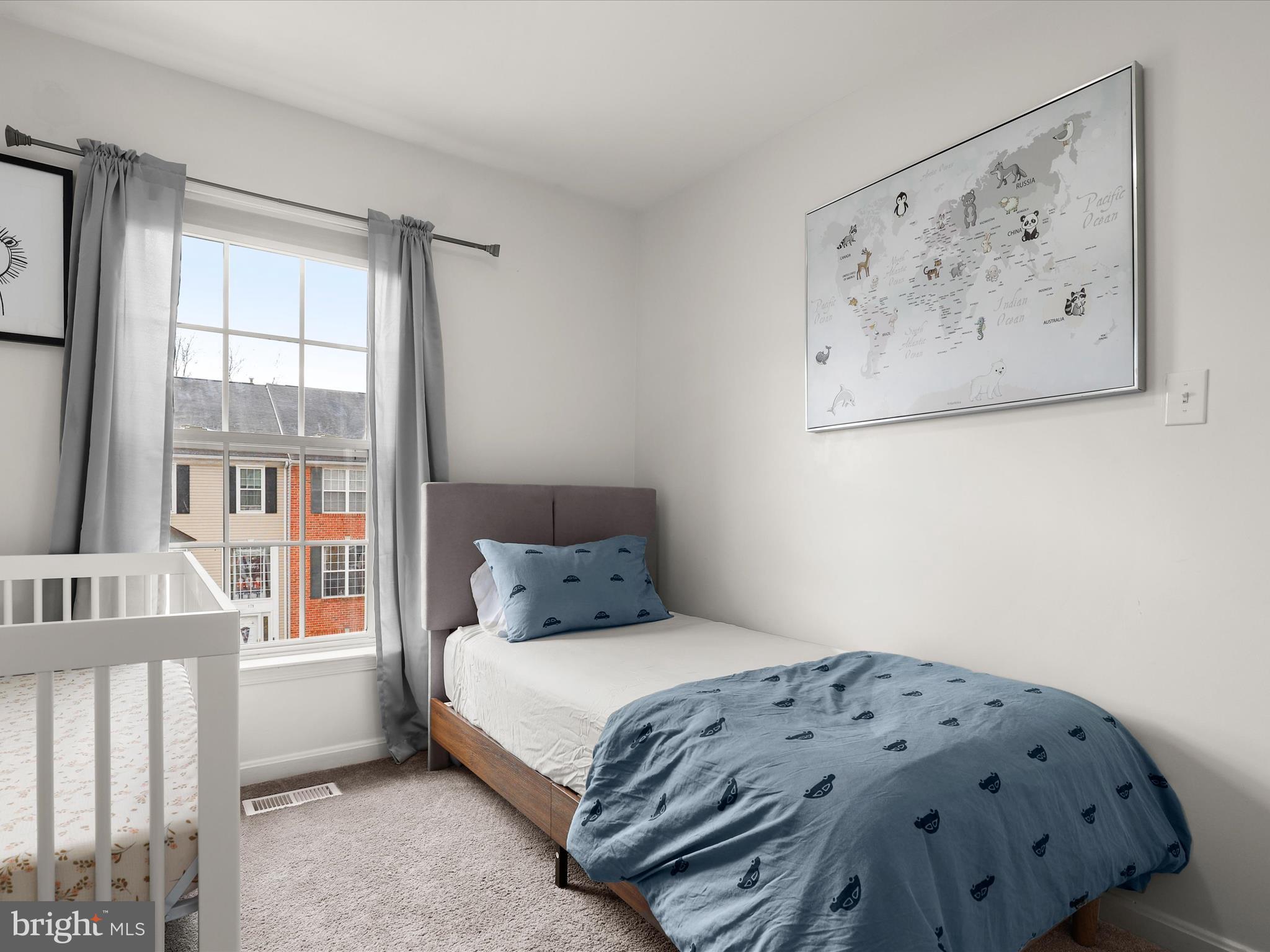 174 Harpers Way Frederick, MD 21702 - Photo 22 of 56 a bedroom with a bed and a window
