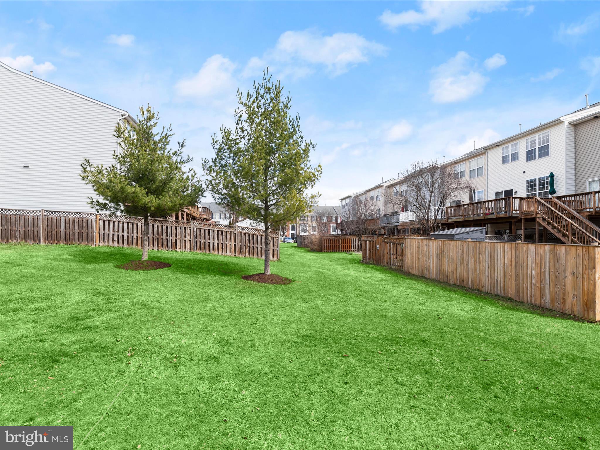 174 Harpers Way Frederick, MD 21702 - Photo 33 of 56 a view of a yard with a wooden fence