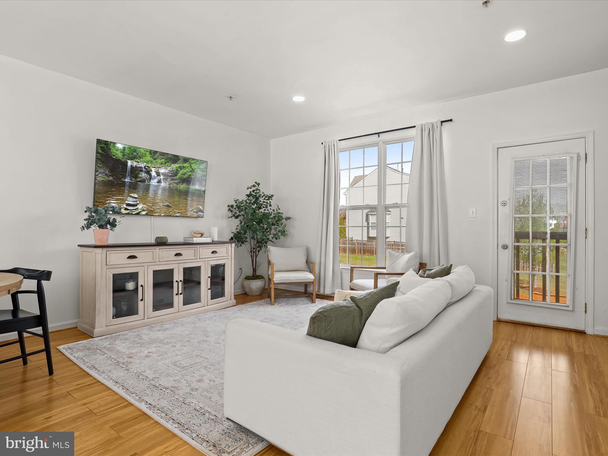 174 Harpers Way Frederick, MD 21702 - Photo 4 of 56 a living room with furniture and a large window