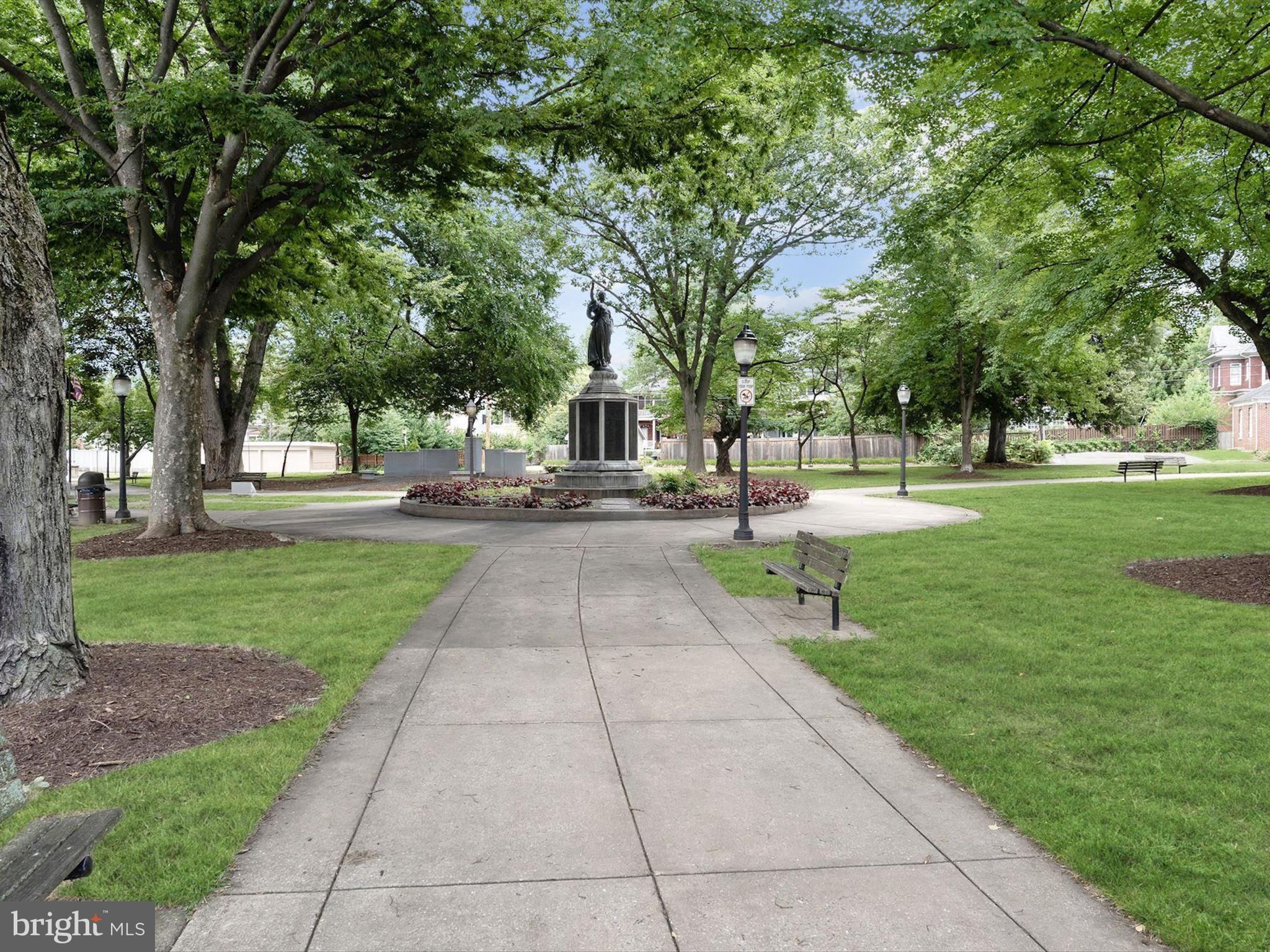 174 Harpers Way Frederick, MD 21702 - Photo 50 of 56 a view of a park with bench and trees