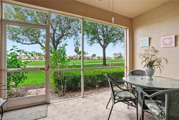 a view of a patio with a yard