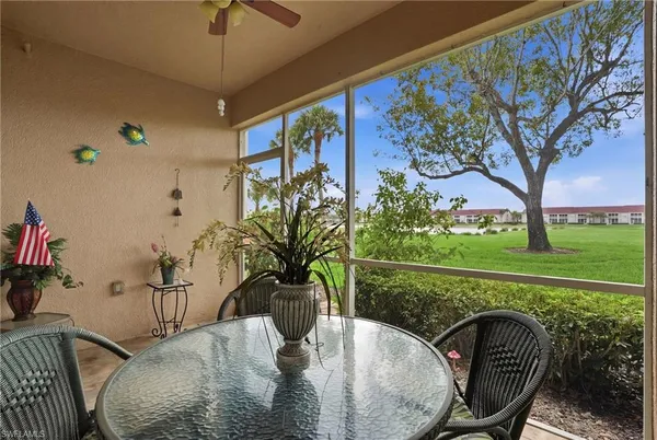 a view of a dining room with furniture window and outside view