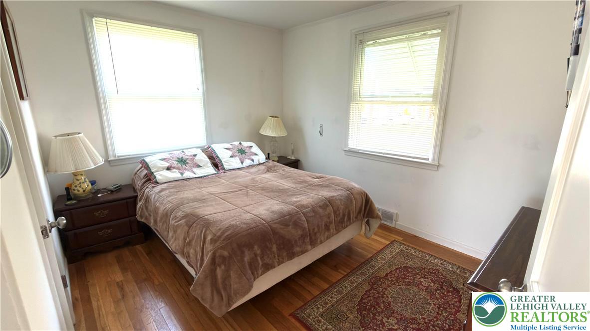 462 Maple Road Hellertown, PA 18055 - Photo 13 of 25 a bedroom with a bed and a window