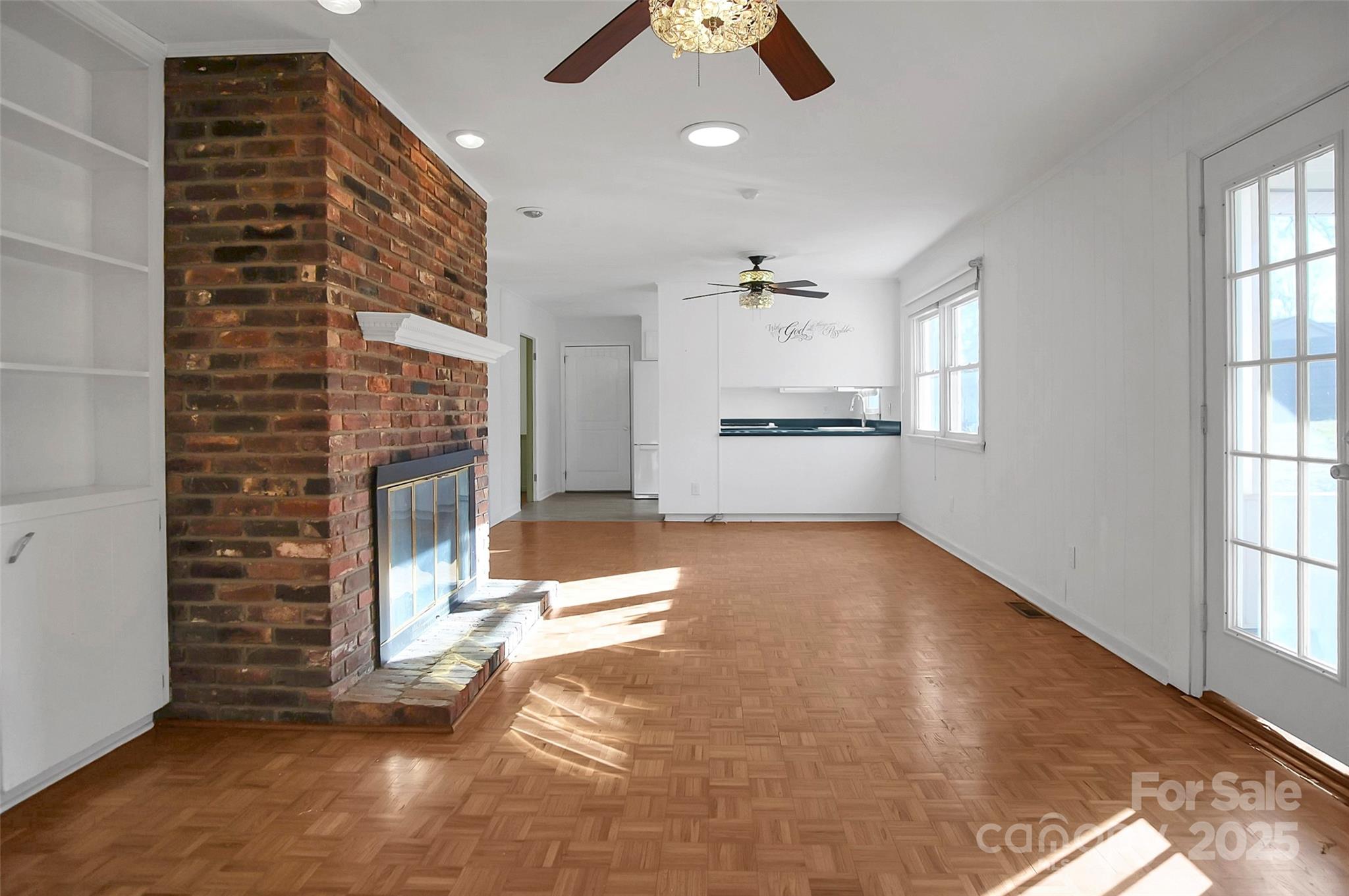 1925 Montclair Avenue Gastonia, NC 28054 - Photo 20 of 35 a living room with stainless steel appliances kitchen island granite countertop furniture a fireplace and a window