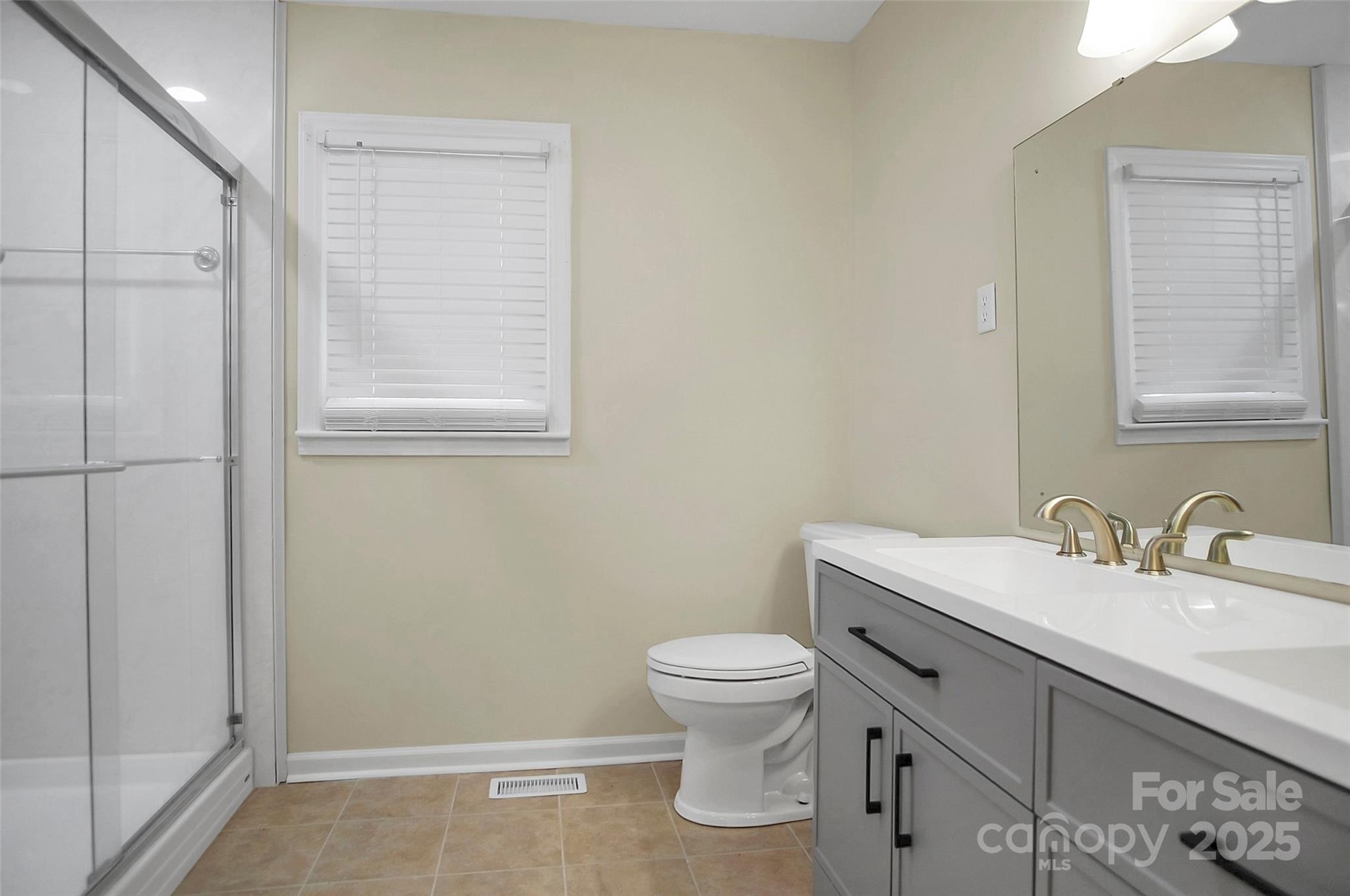 1925 Montclair Avenue Gastonia, NC 28054 - Photo 29 of 35 a bathroom with a sink toilet and vanity