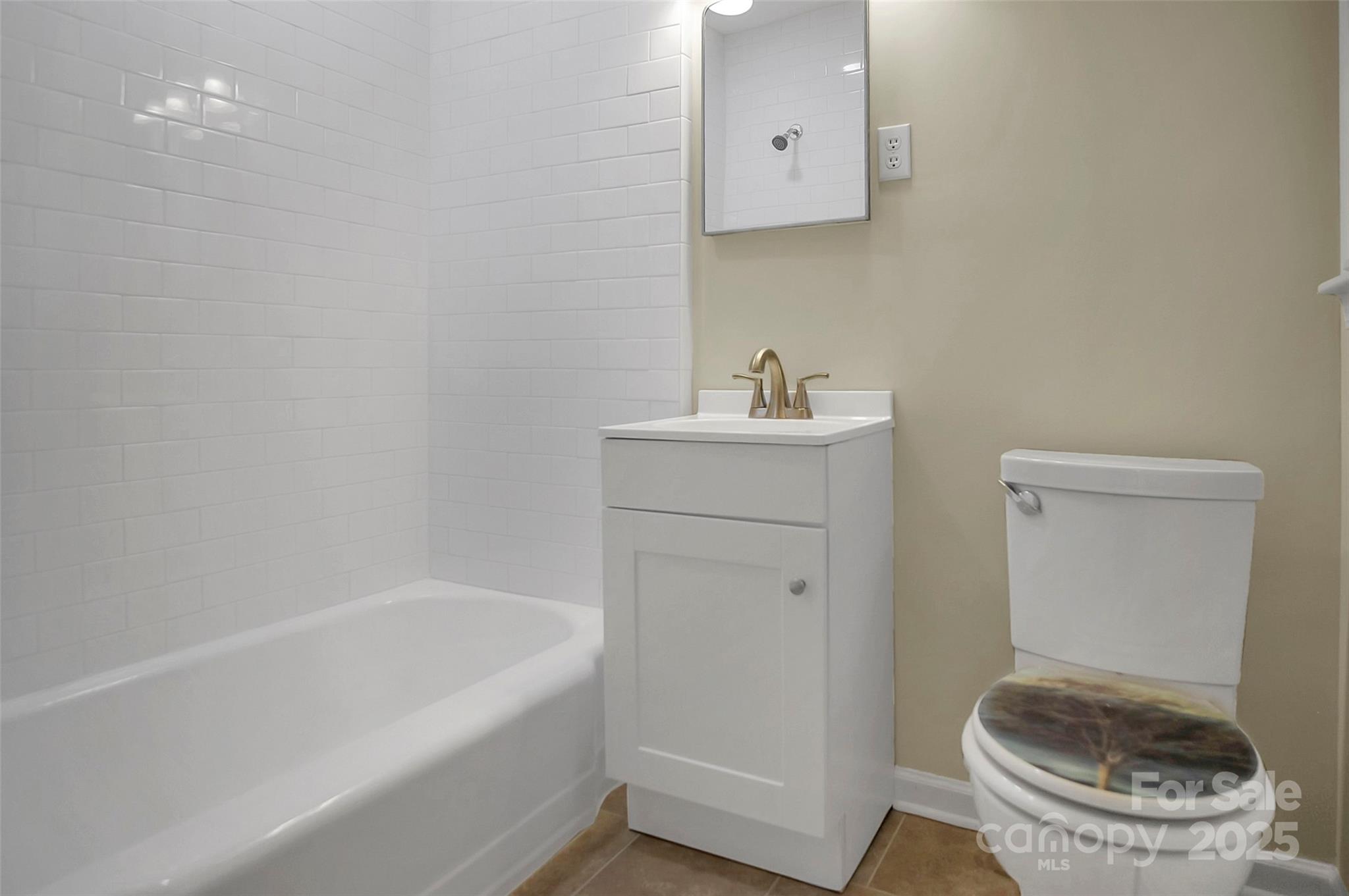 1925 Montclair Avenue Gastonia, NC 28054 - Photo 34 of 35 a bathroom with a sink a toilet and bathtub