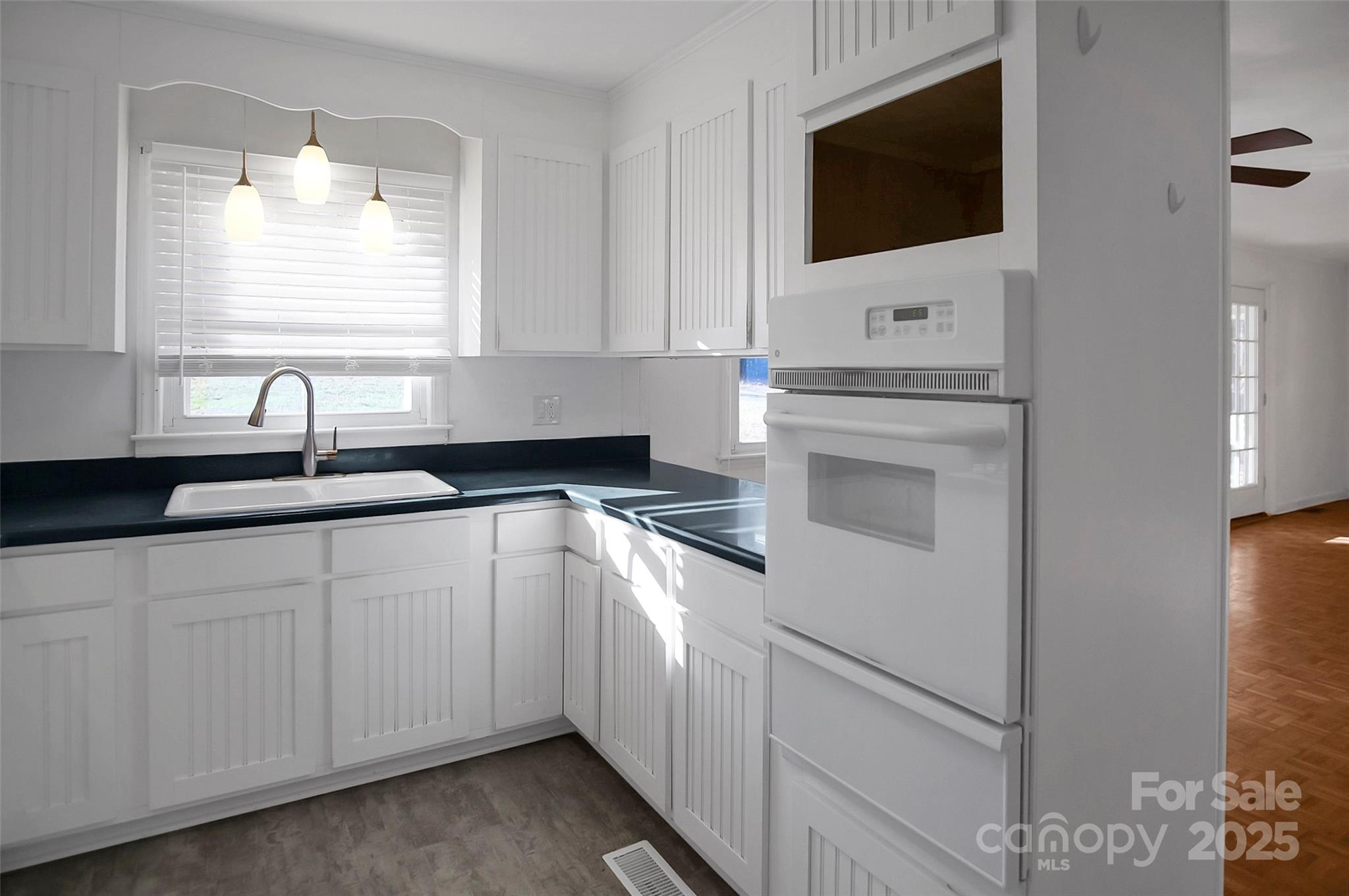 1925 Montclair Avenue Gastonia, NC 28054 - Photo 10 of 35 a kitchen with a sink and a microwave