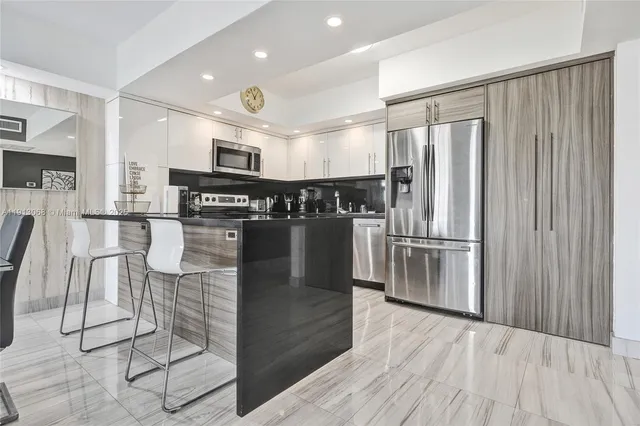 a kitchen with lots of counter top space and appliances