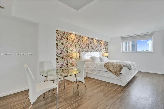 a bathroom with a sink a mirror and a shower