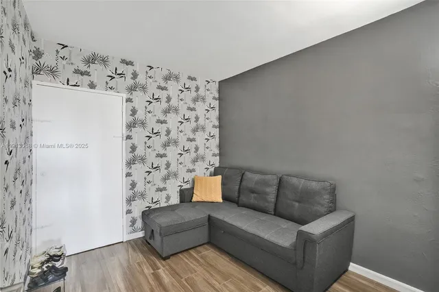 a bathroom with a sink a light fixture and a mirror
