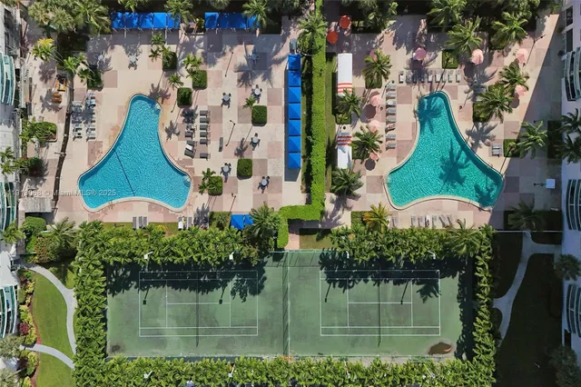 a living room with furniture a table and a large window