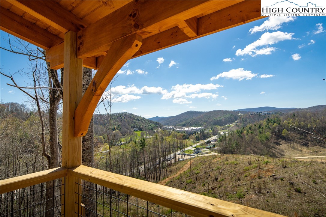 a view of a forest from a balcony