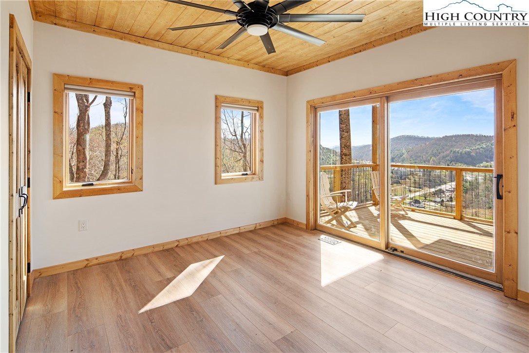 330 Maplewood Circle Boone, NC 28607 - Photo 11 of 44 a view of an empty room window and wooden floor