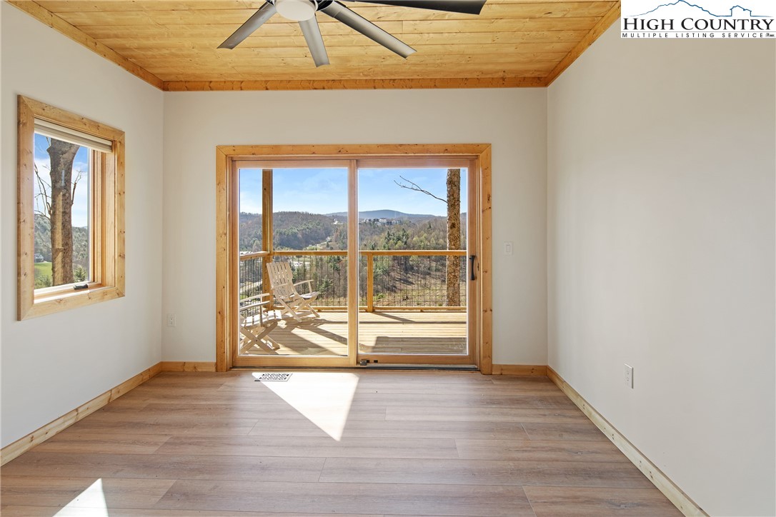330 Maplewood Circle Boone, NC 28607 - Photo 12 of 44 a view of an empty room with wooden floor and a window