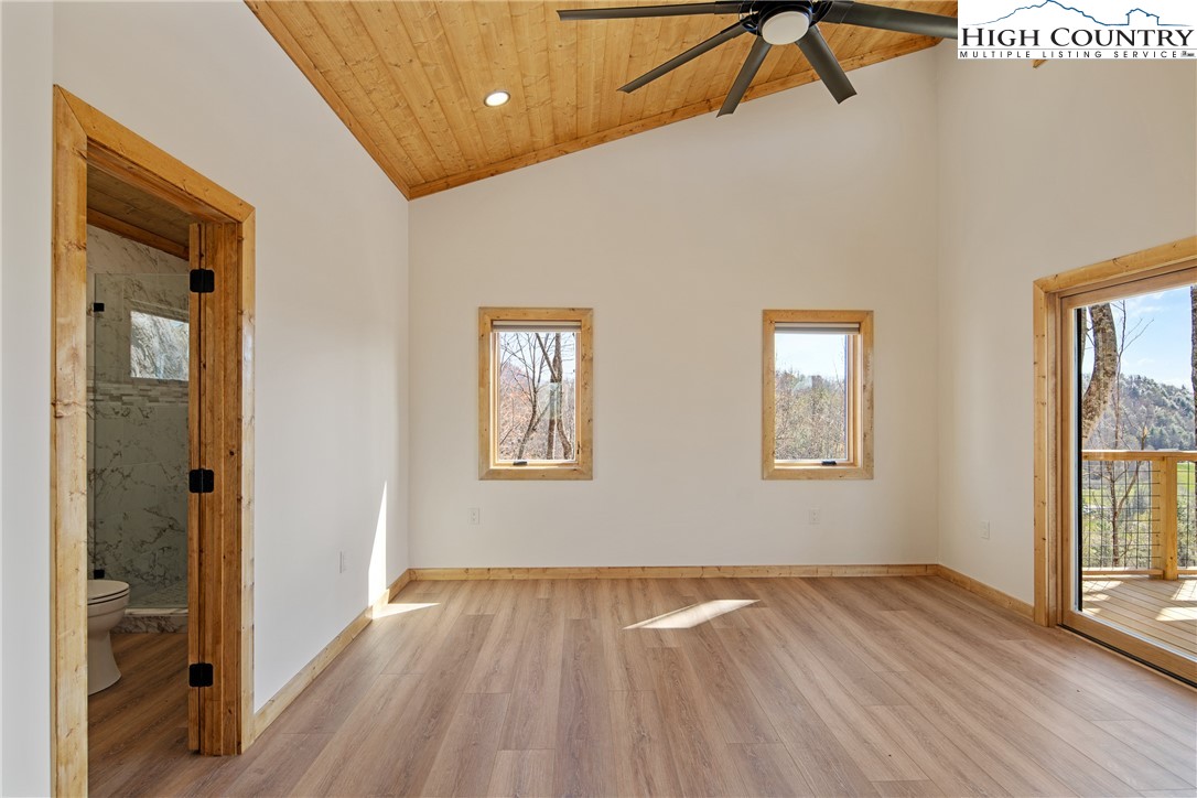 330 Maplewood Circle Boone, NC 28607 - Photo 19 of 44 a view of an empty room with wooden floor and a window