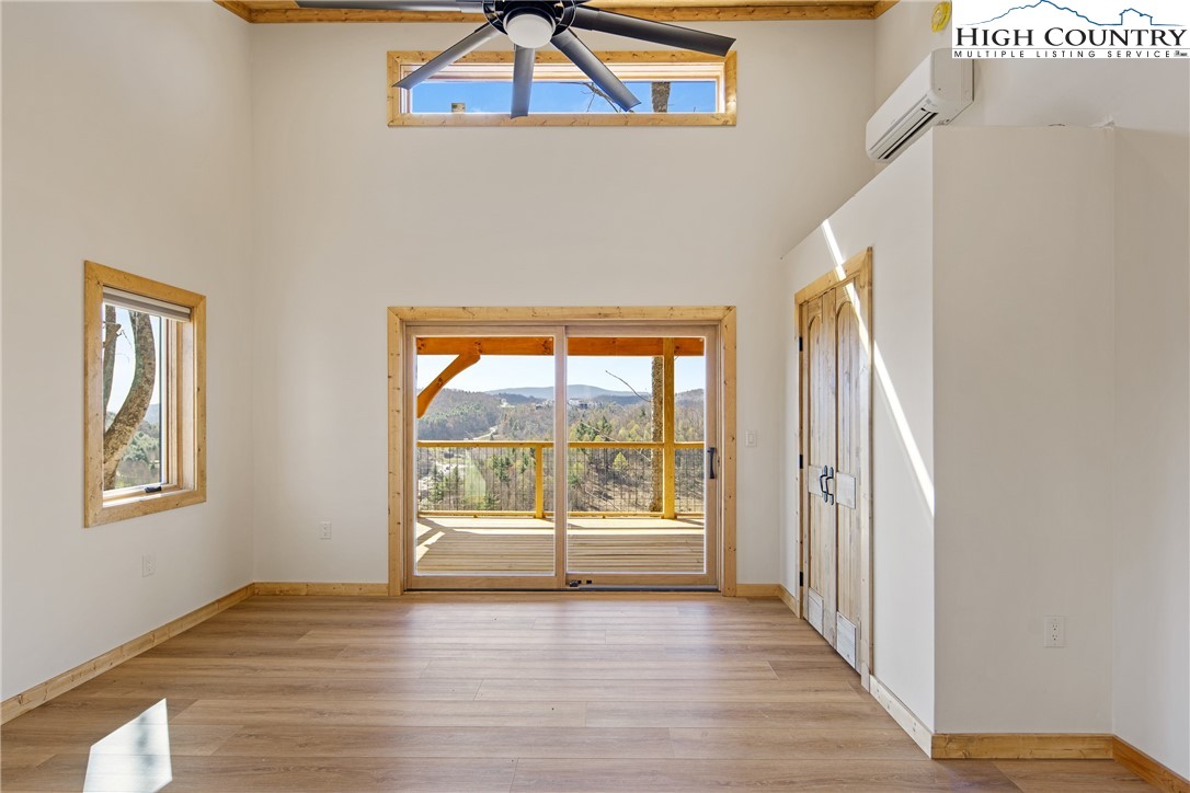 330 Maplewood Circle Boone, NC 28607 - Photo 20 of 44 a view of an empty room with wooden floor and window