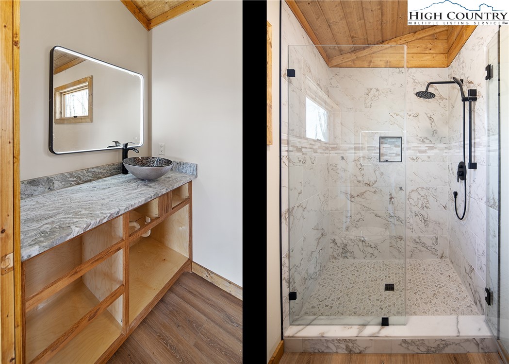 330 Maplewood Circle Boone, NC 28607 - Photo 25 of 44 a bathroom with a granite countertop sink a mirror and shower
