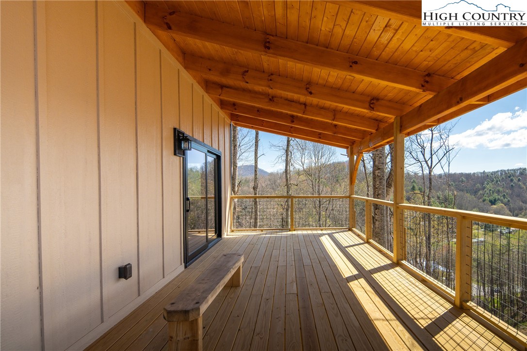 330 Maplewood Circle Boone, NC 28607 - Photo 26 of 44 a view of balcony with a floor to ceiling window with wooden floor