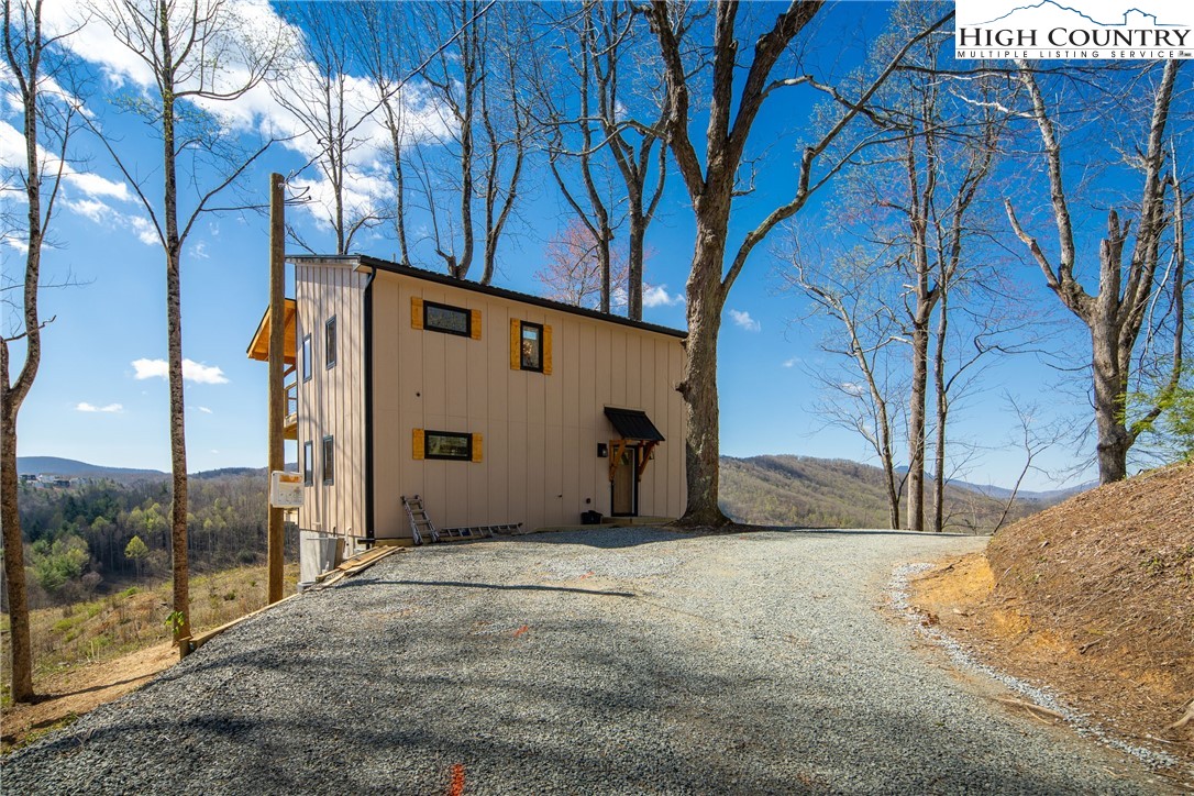 330 Maplewood Circle Boone, NC 28607 - Photo 40 of 44 a view of a house with a snow in the yard
