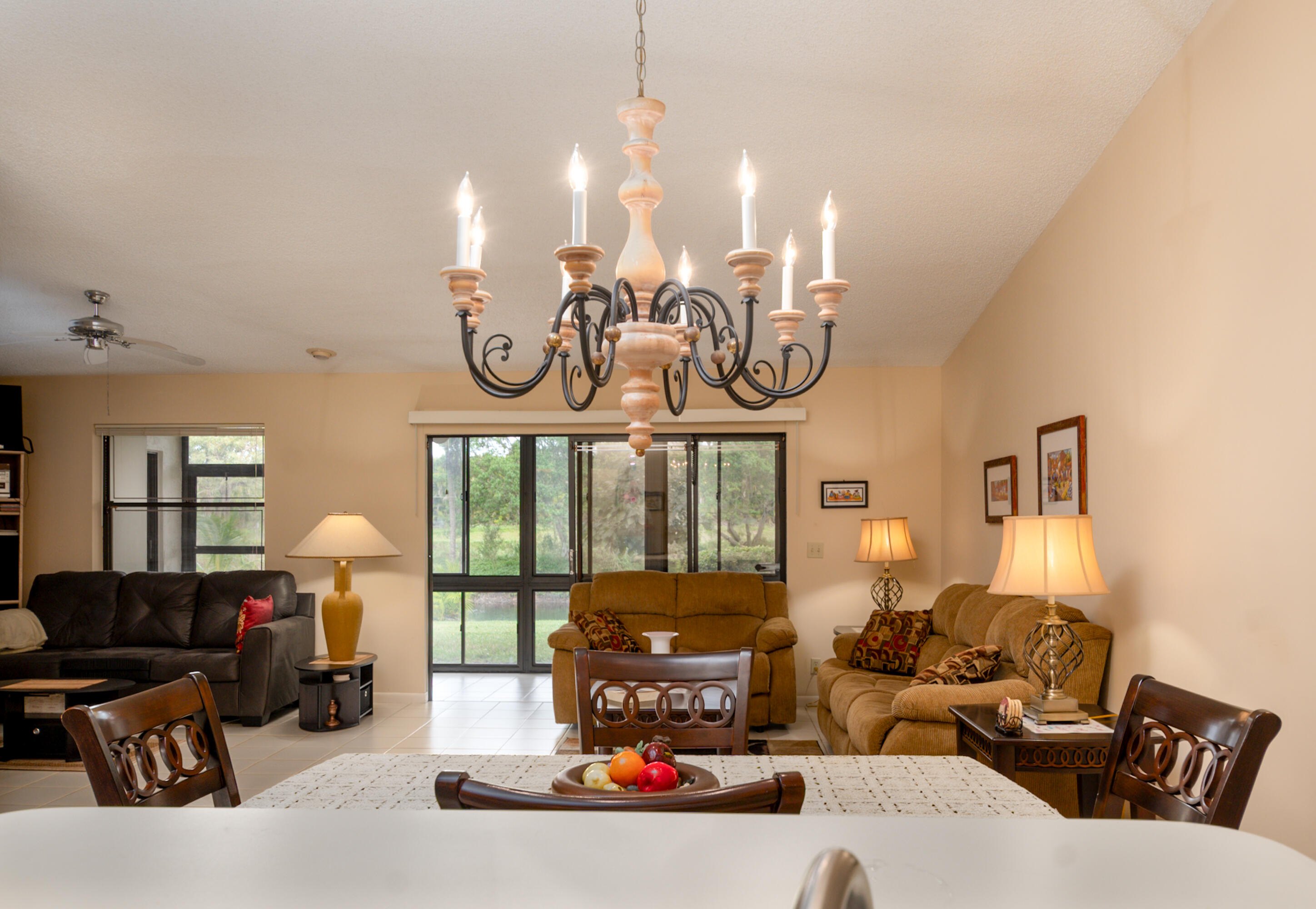 10867 Waterberry Court Boca Raton, FL 33498 - Photo 11 of 30 a living room with furniture and chandelier