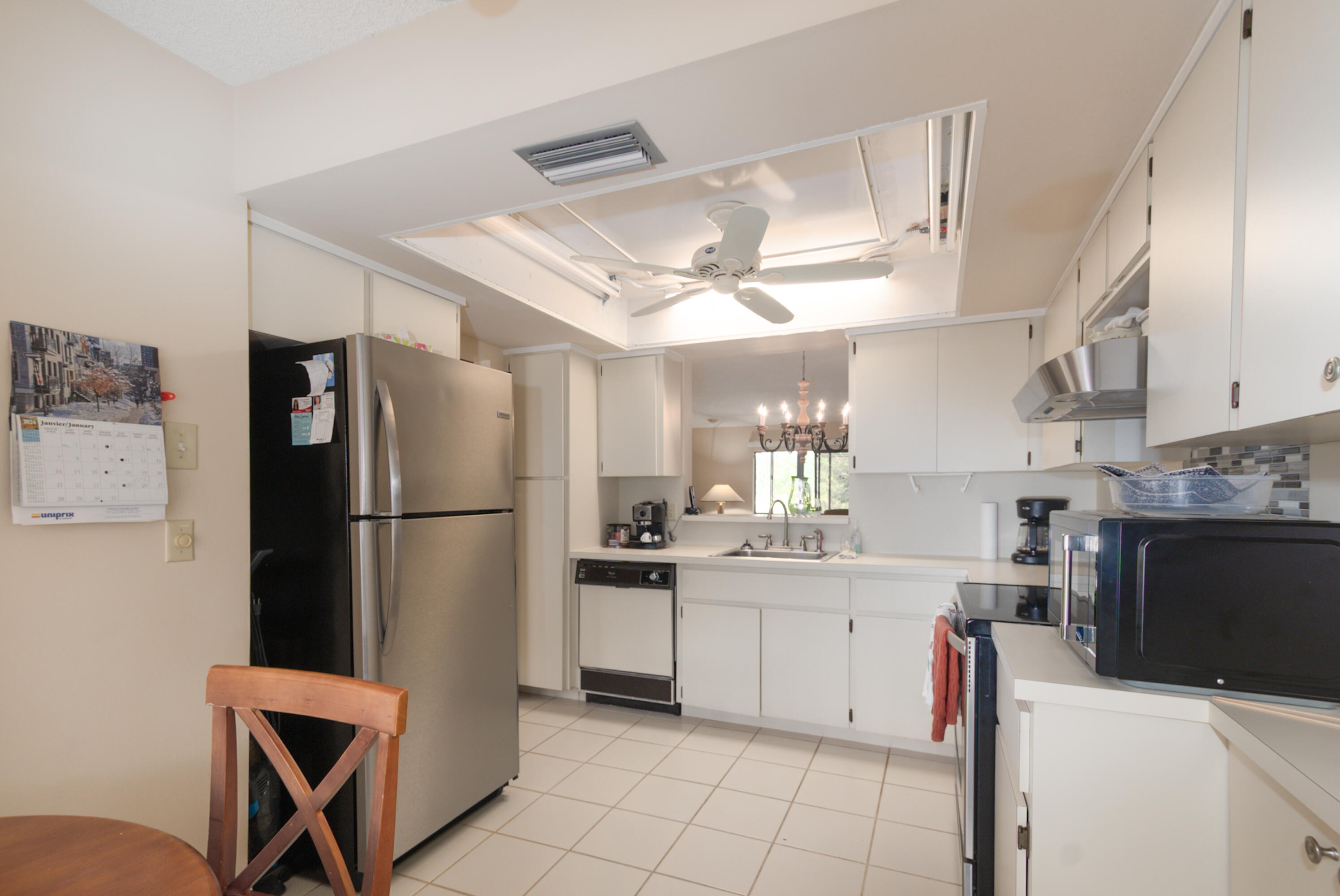 10867 Waterberry Court Boca Raton, FL 33498 - Photo 13 of 30 a kitchen with a refrigerator a sink dishwasher and a refrigerator