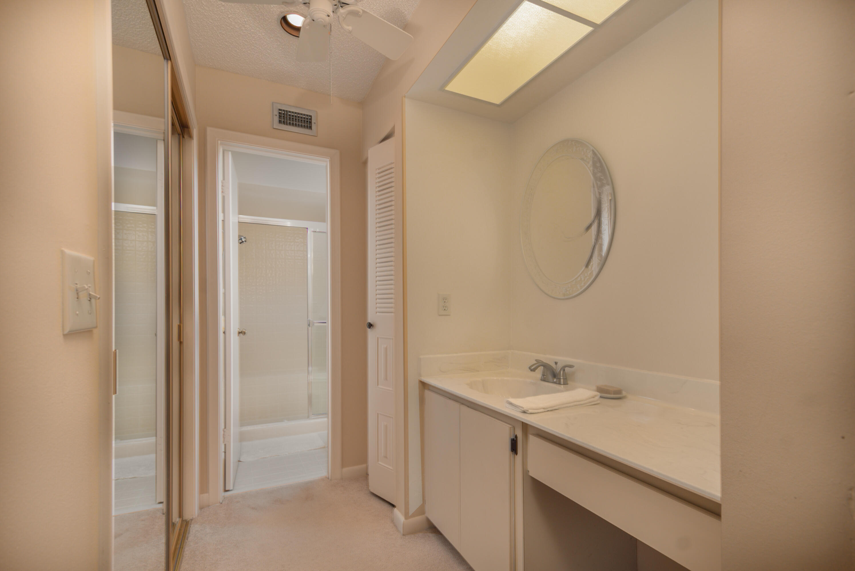 10867 Waterberry Court Boca Raton, FL 33498 - Photo 15 of 30 a bathroom with a sink and a mirror