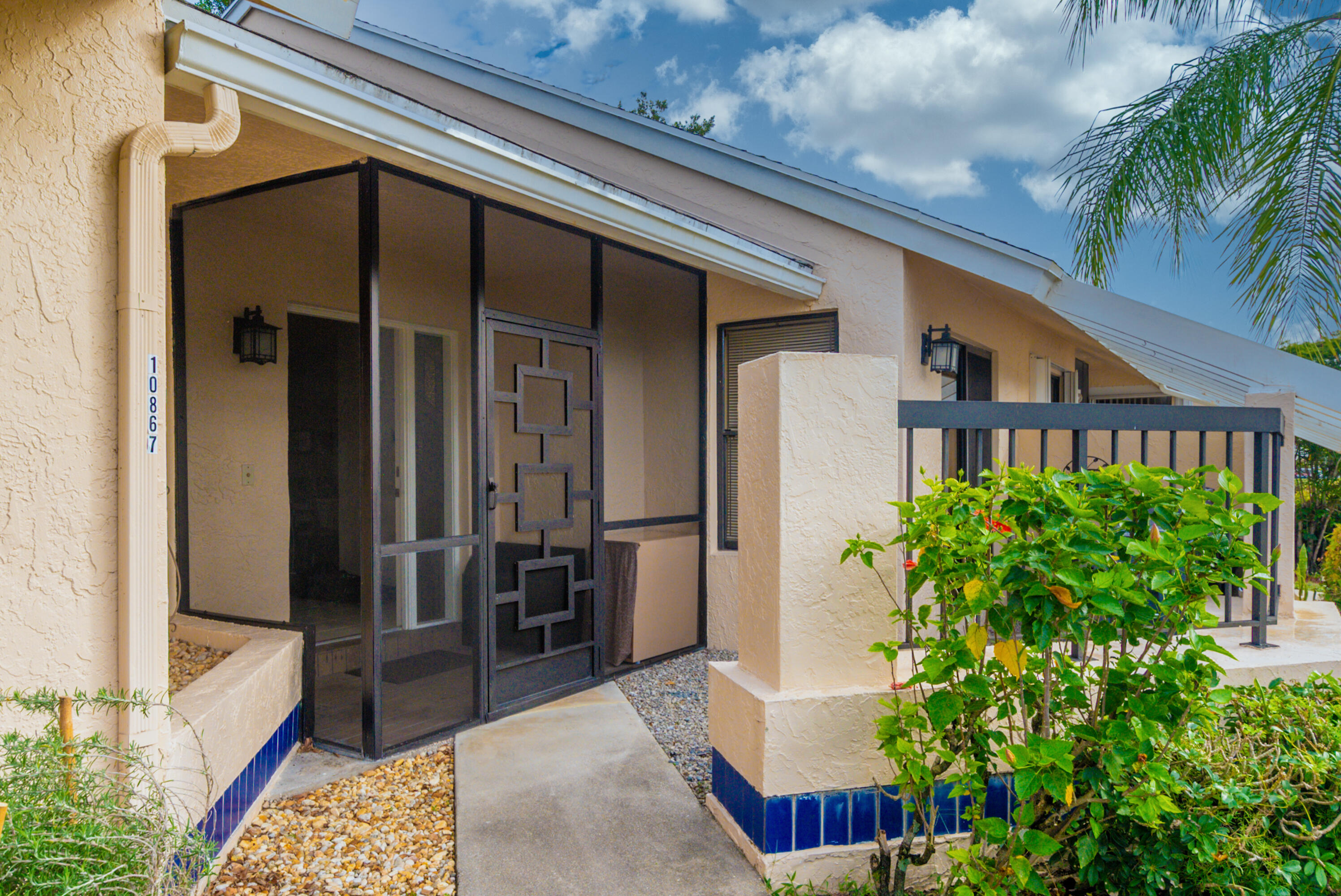 10867 Waterberry Court Boca Raton, FL 33498 - Photo 19 of 30 a view of front door and potted plants