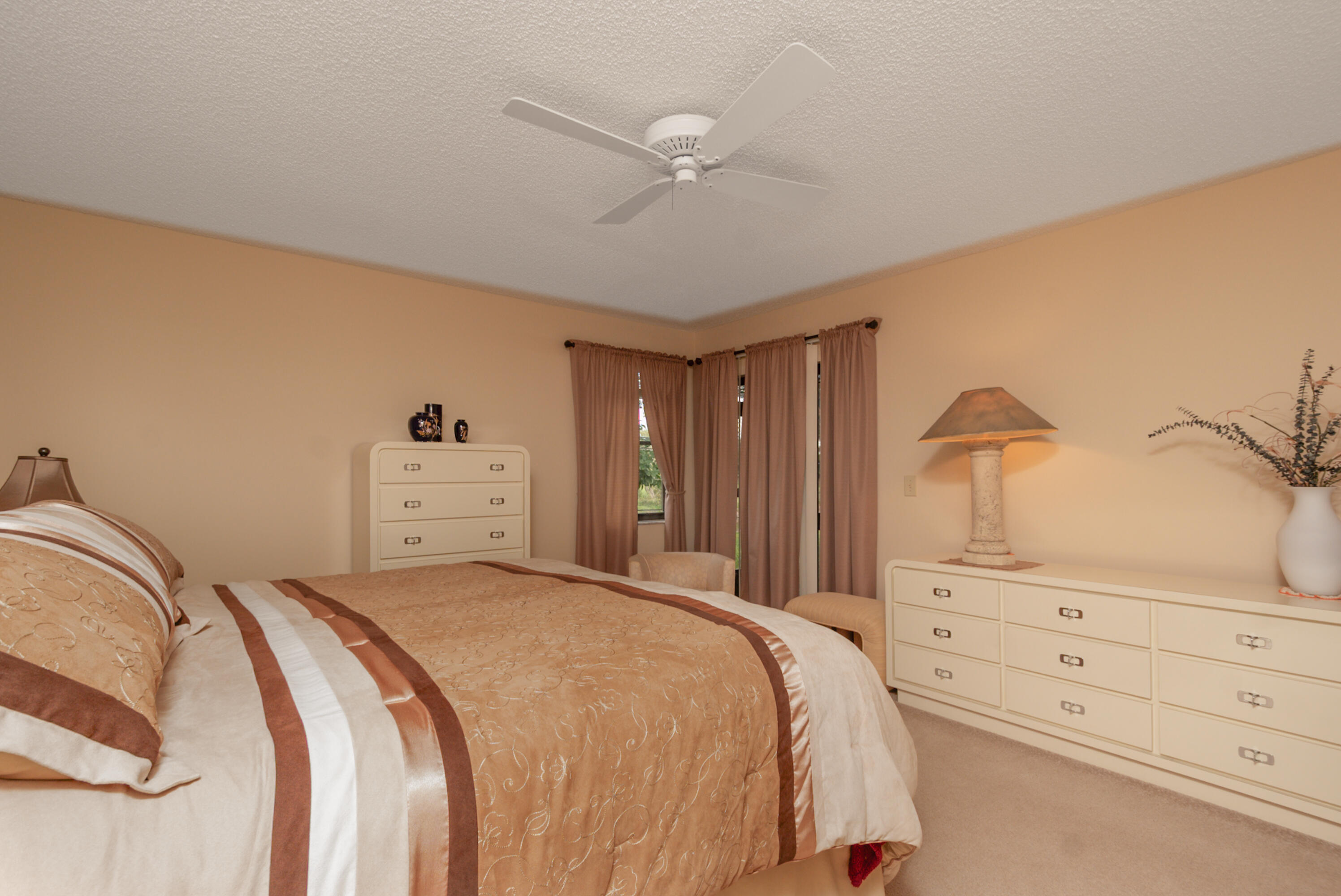 10867 Waterberry Court Boca Raton, FL 33498 - Photo 24 of 30 a bedroom with a bed and a closet