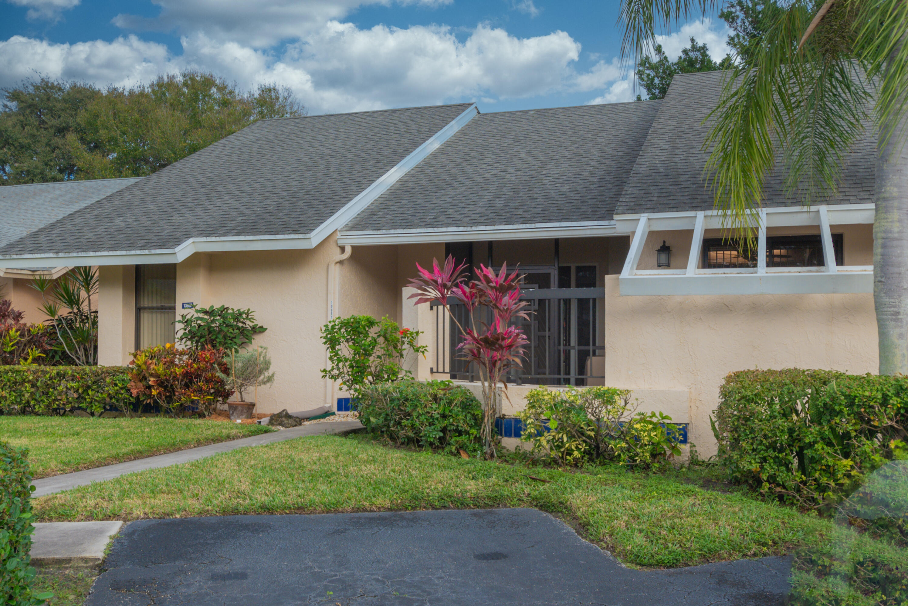 10867 Waterberry Court Boca Raton, FL 33498 - Photo 26 of 30 a front view of a house with garden