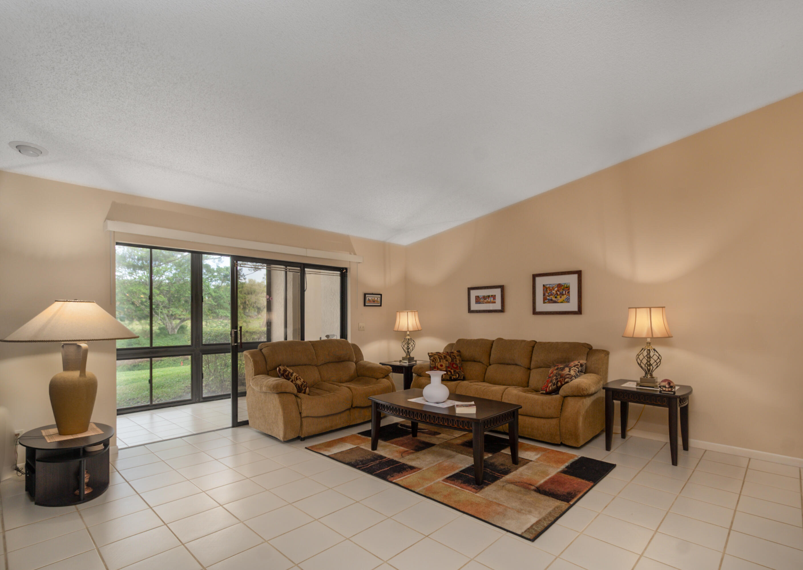 10867 Waterberry Court Boca Raton, FL 33498 - Photo 3 of 30 a living room with furniture and a large window