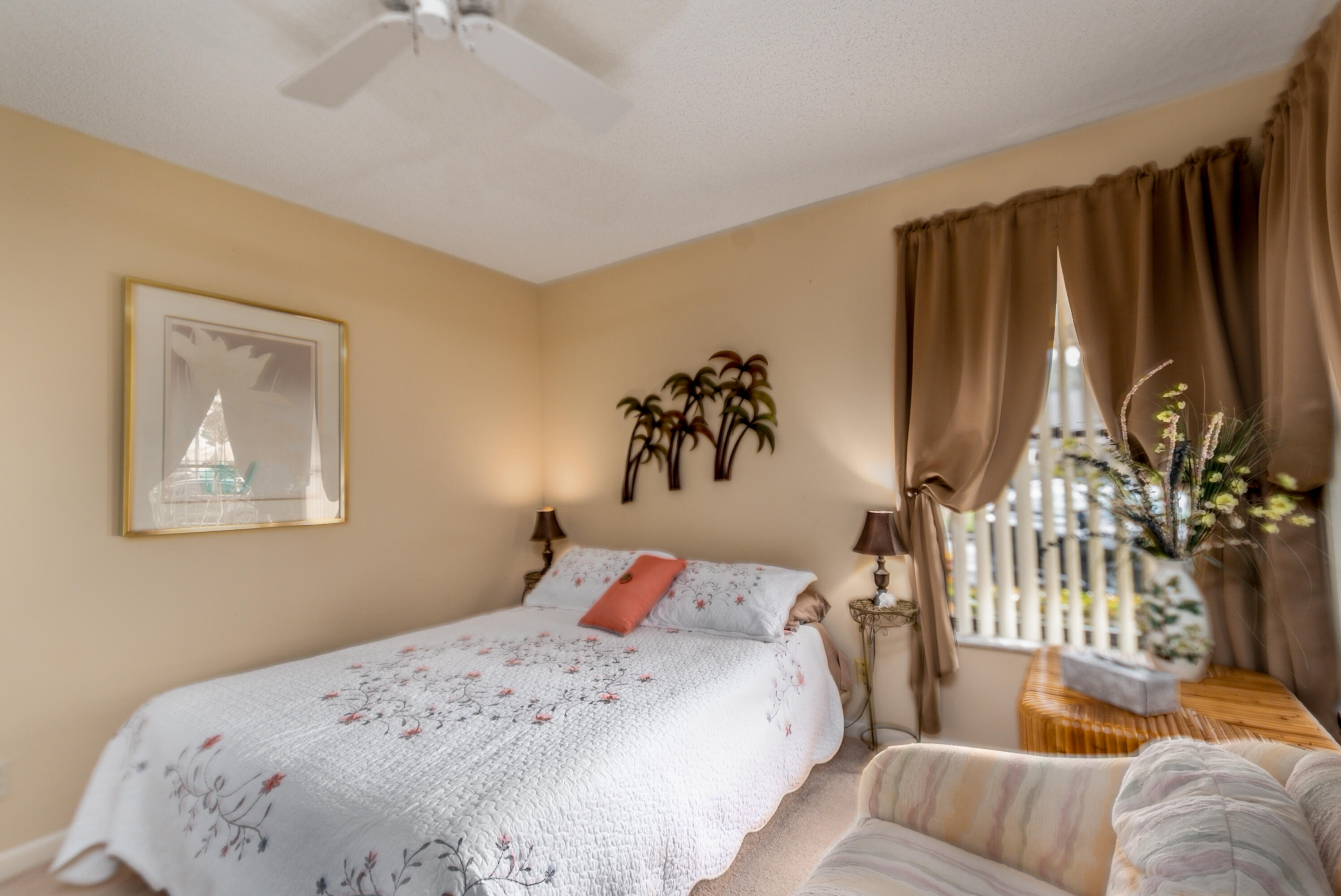 10867 Waterberry Court Boca Raton, FL 33498 - Photo 7 of 30 a bedroom with a bed and a painting on the wall
