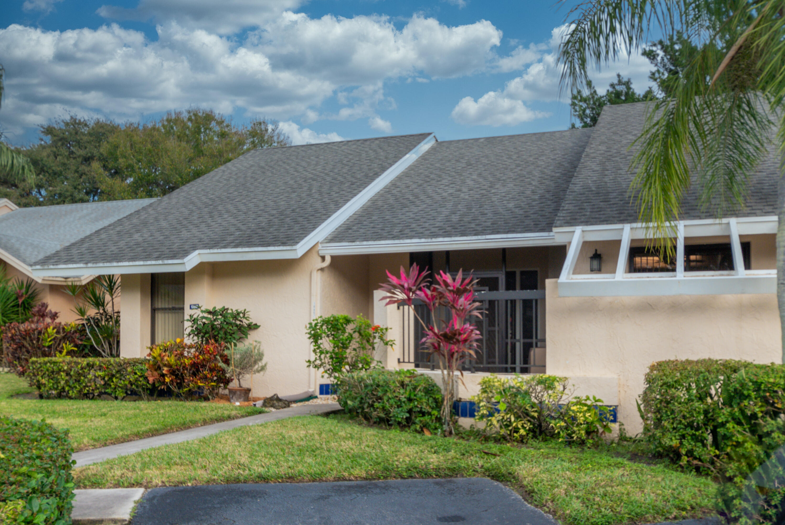 10867 Waterberry Court Boca Raton, FL 33498 - Photo 8 of 30 a front view of a house with garden