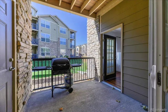 a view of a porch with a floor to ceiling window
