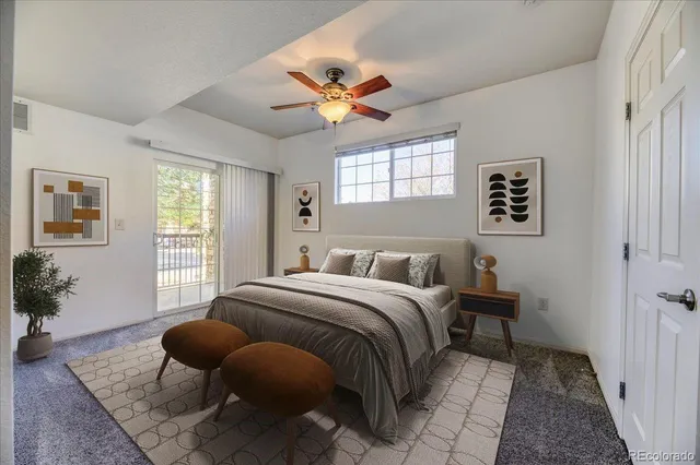 a bedroom with a bed and glass windows