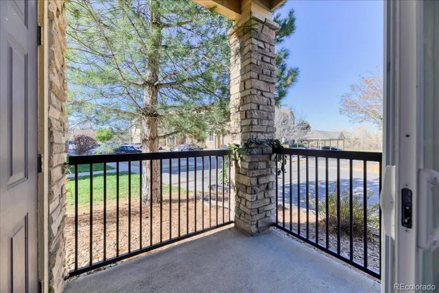 a view of a balcony with a tree