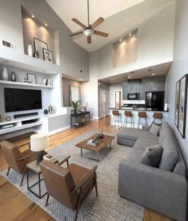 1045 Bonner Street Houston, TX 77007 - Photo 5 of 14 a living room with furniture kitchen view and a flat screen tv
