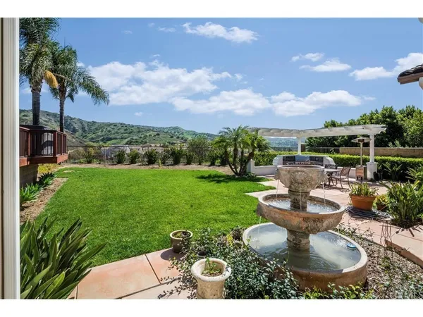 a view of a backyard with sitting area