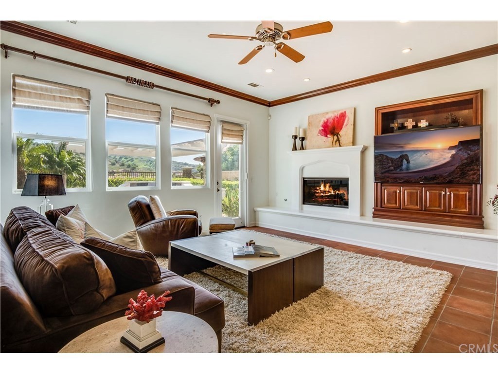 440 Tangerine Place Brea, CA 92823 - Photo 8 of 24 a living room with furniture flat screen tv and a fireplace