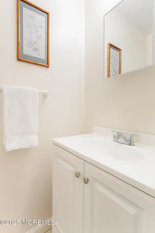 a bathroom with a shower and a sink