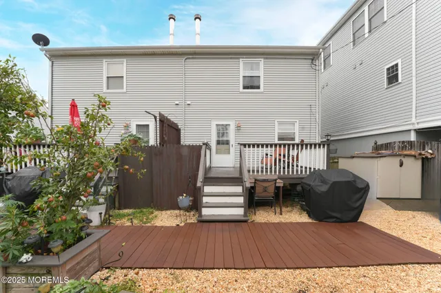 a view of a house with wooden floor and a chair