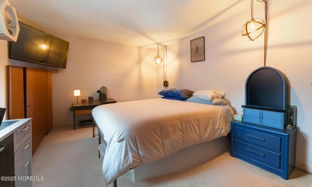 a bed room with a bed and a mirror