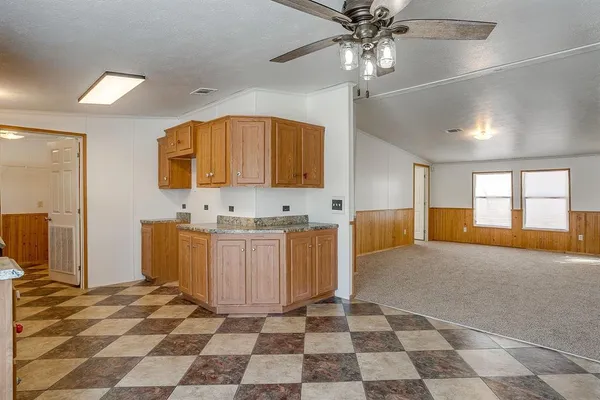 a spacious bathroom with a double vanity sink a mirror and a shower