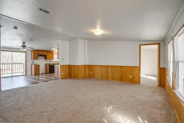 an empty room with windows and pillars in it