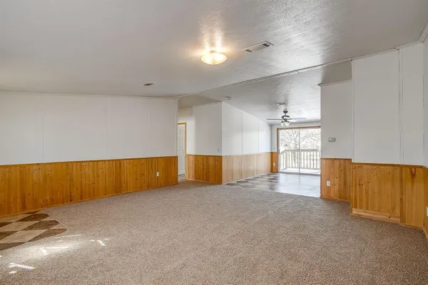 a view of an empty room with windows