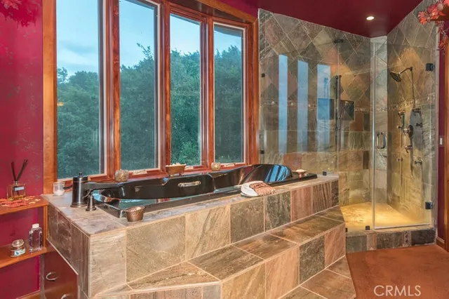 a room with gym equipment and large windows